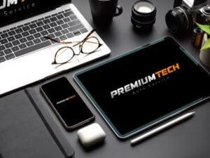 Mock up digital devices with tablet, smartphone and laptop on black table